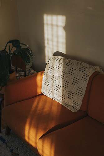 crossword puzzle white textile on brown couch game